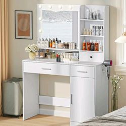 Vanity Desk Woth Lighted Mirror, And Power Outlet  Makeup Desk For Bedroom Stool and 3 Drawers And 4 Storage Shelves, New In A Box.

Assembly required