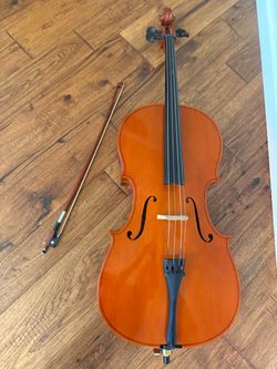 1/2 cello with hard  case and a bow