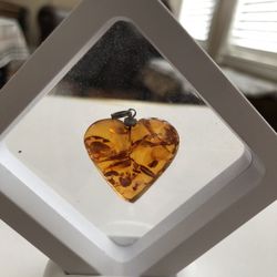 This beautiful cognac amber heart pendant with a little touch of sterling silver on the top will make a perfect gift .please Look At My Profile To See