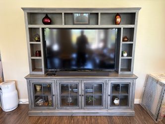 Entertainment center, 84” w x 81.5” h x 17.5” d with 58.75 x 35.5” opening for tv.