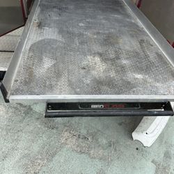 Bed truck sliding tray