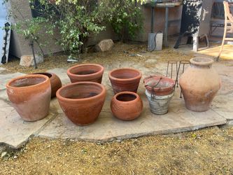 Assorted Terracotta pots, water hose holder and small iron plant stands