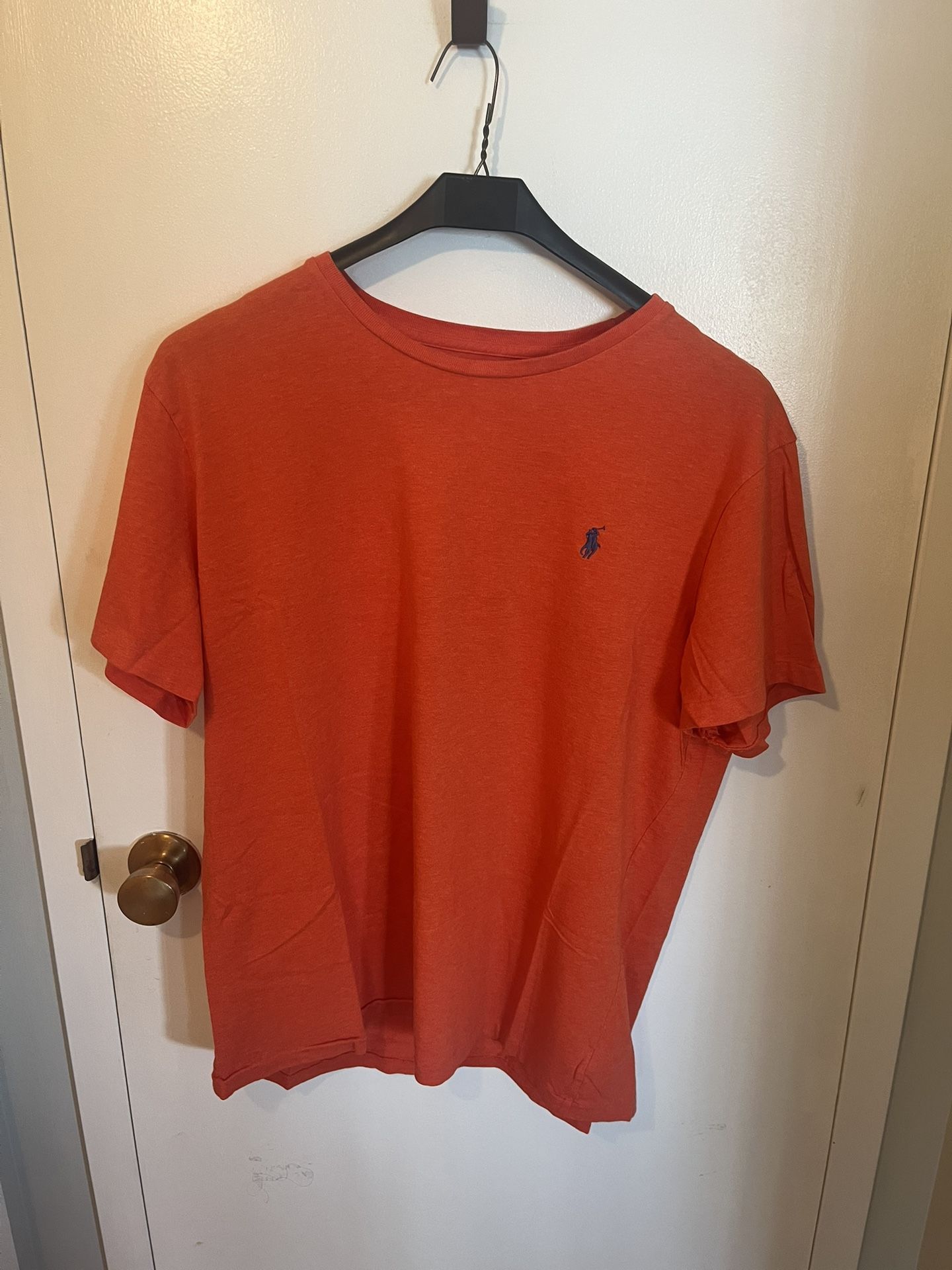 Polo By Ralph Lauren. Bold Orange Polo t-shirt with classic branding. Ideal for casual outings. Mint Condition . Best offer.