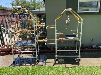 Two large bird perches with toys