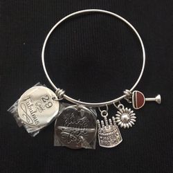 Silver color bracelet with happy birthday and wine charms