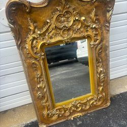 Ornate gold Renaissance mirror.. With engraving from 1966… 43“ x 29” $300