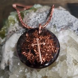 Solara Round Orgonite Pendant – Amethyst, Copper Crucifix & Copper Geometry

The Solara Round Orgonite Pendant is a handcrafted piece made with amethy