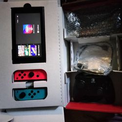 Nintendo Switch With Game Consoles And An Extra Controller For The TV