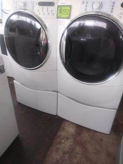Kenmore front load washer and dryer set with pedestals in excellent conditions
