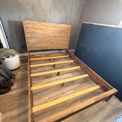 Queen sized wooden bed frame