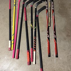 Used street hockey sticks.