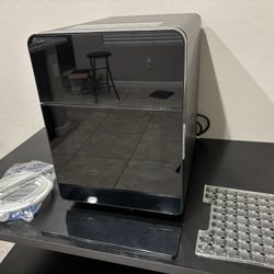 ECOZY 2" Clear Ice Ball Maker with CrystalFlux Technology, Self Cleaning    The ECOZY 2" Clear Ice Ball Maker with CrystalFlux Technology is a sleek c