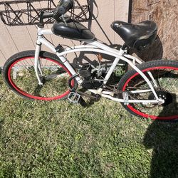 Motorized gas bike - has 2   cycle engine - B probable has bee n ridden 1 mile - cleaning out storage.     I need it gone