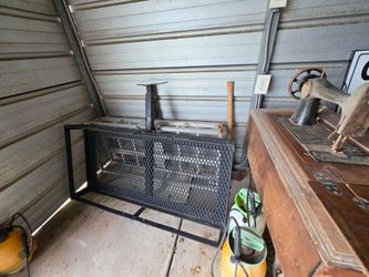 black steel hitch-mounted cargo carrier