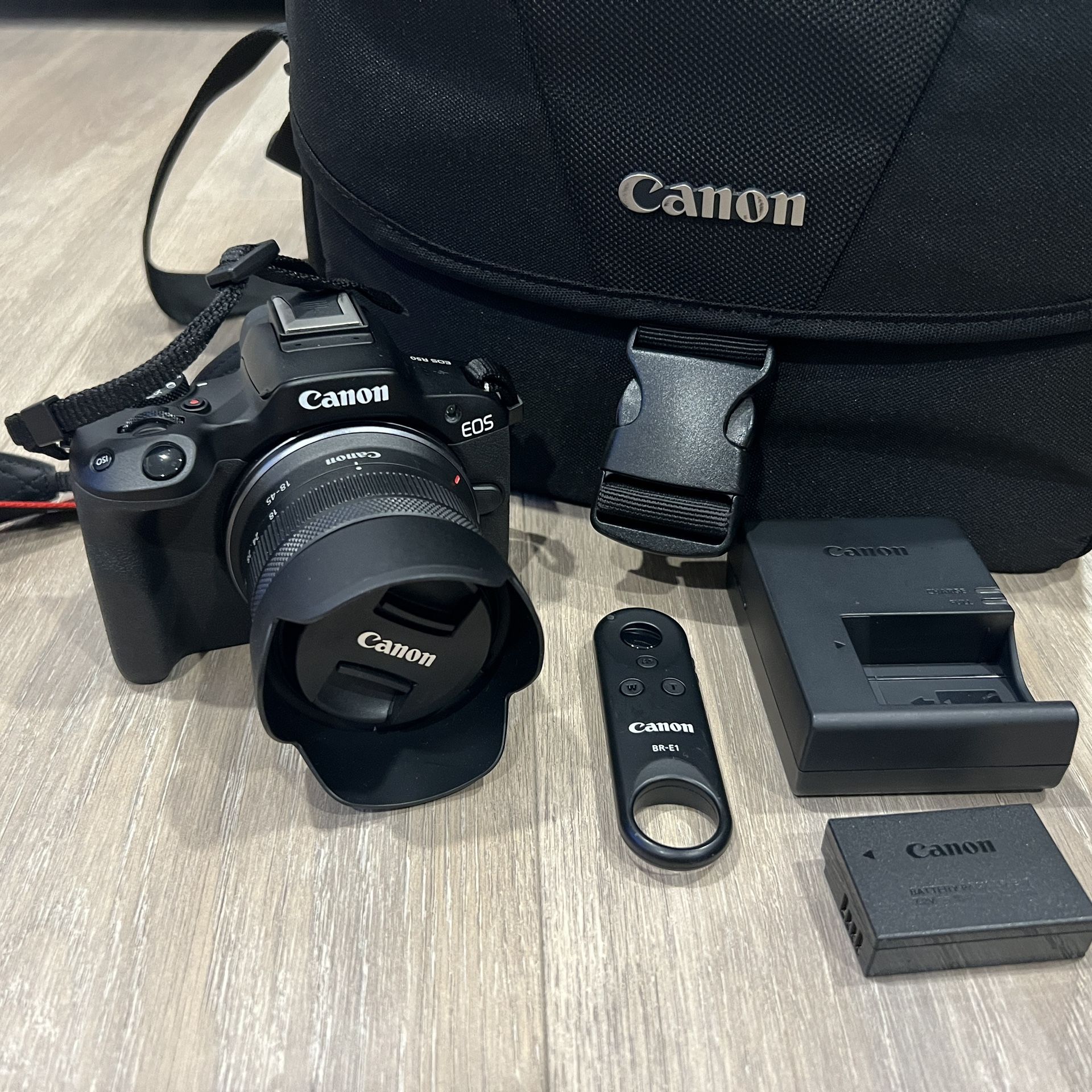 Canon EOS R50 + 18-45 Lens + Extra Battery + Remote + Case