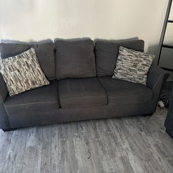 Grey couch with pull out bed and love seat 