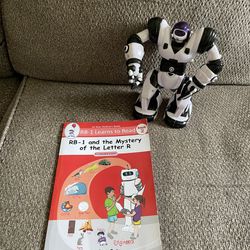 Robot toy with lights and sounds. Book included.