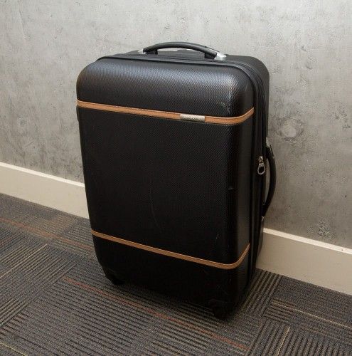 Black Samsonite 4 wheel upright spinner style checked bag