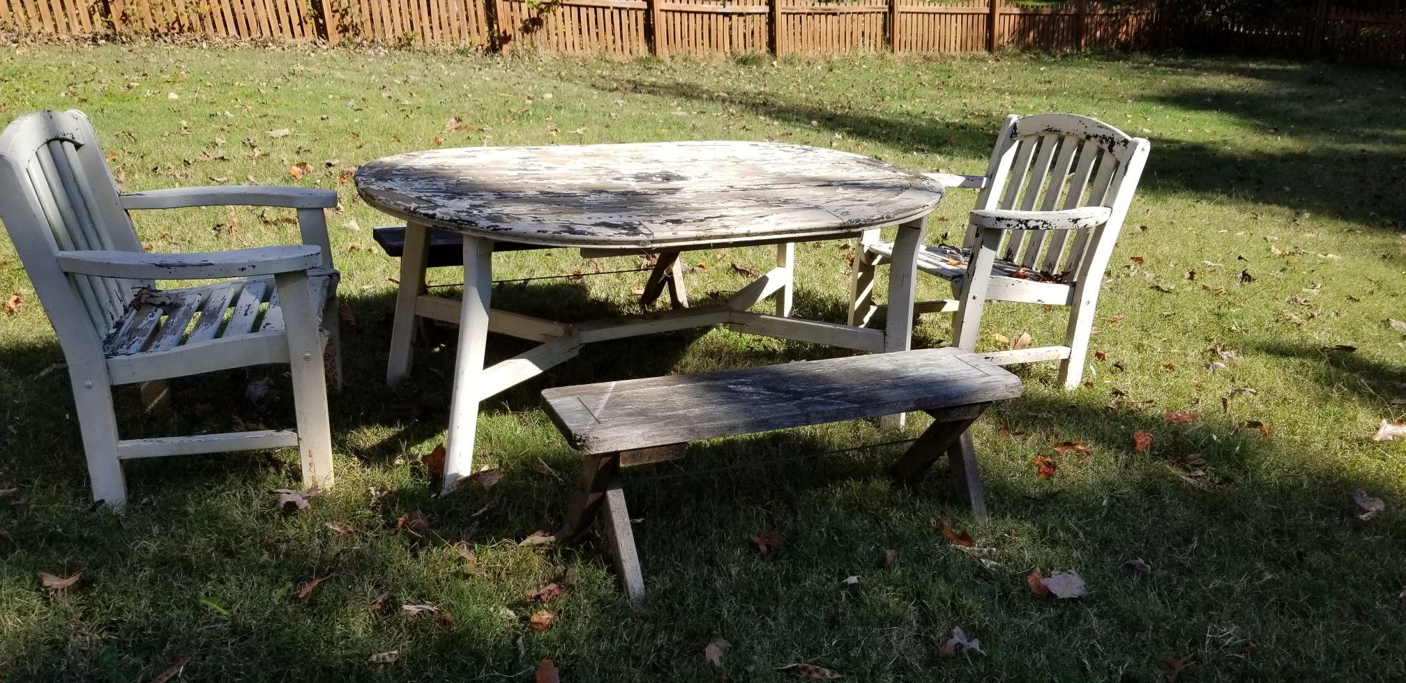 Teak outdoor table with two chairs and two benches
