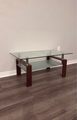 MUST GO MOVING SOON: Brown legged Glass coffee table
