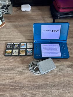 Nintendo DSI with the charger and games