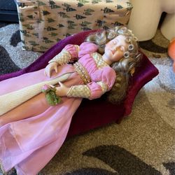 Sleeping beauty doll On chase lounge