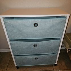 three-drawer storage unit on wheels