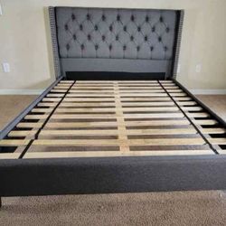 grey upholstered queen platform bed 