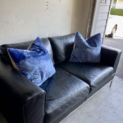 Black Leather Couch With Blue Suede Pillows