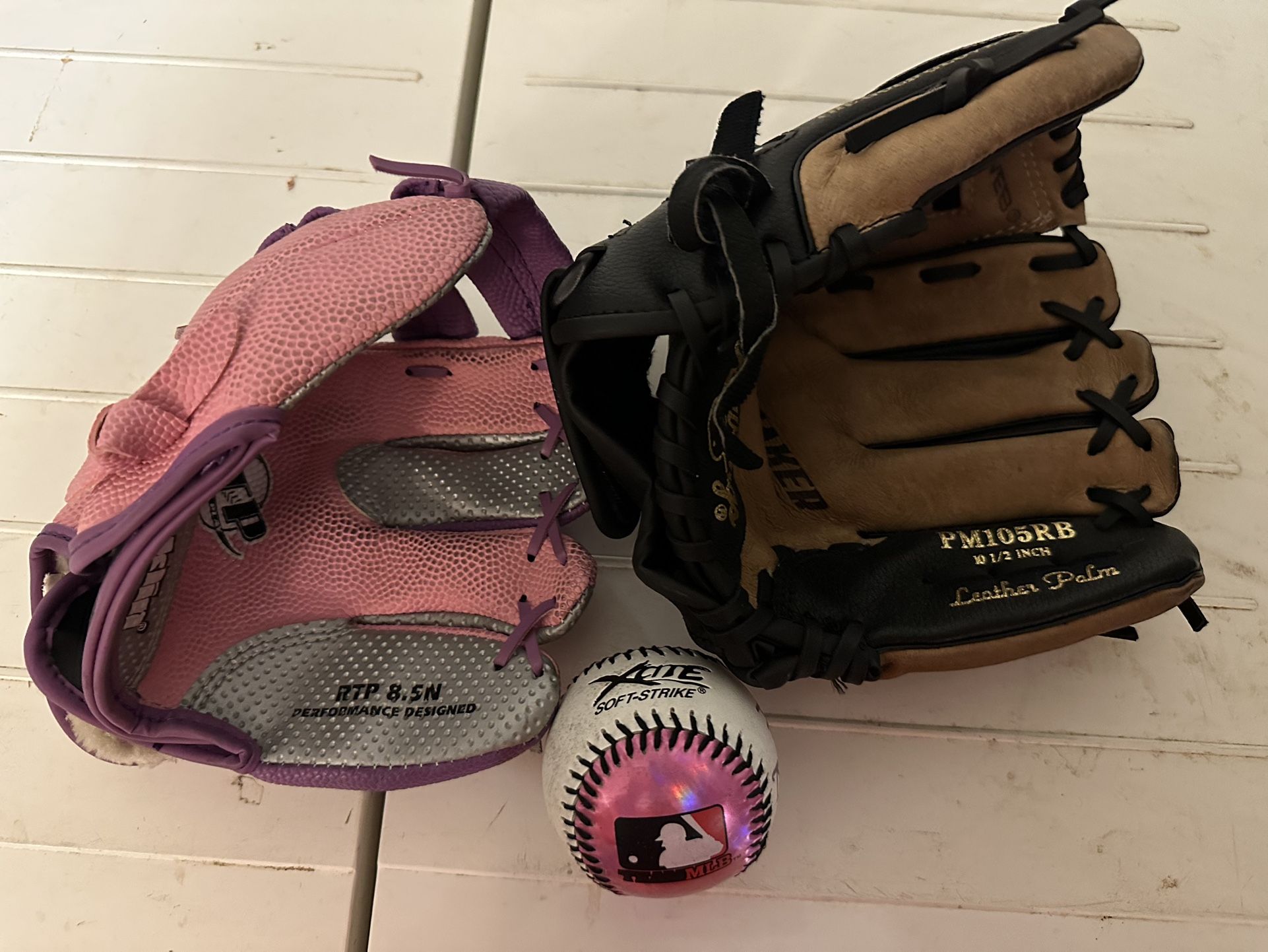 Two baseball gloves with one ball for kids