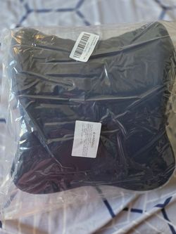 Ergonomic headrest for office chair, with removable washable cover.
