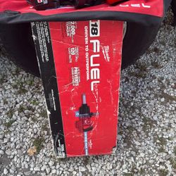 New M18  1 Inch Milwaukee Impact Gun With Two12 Hms Batteries, And Charger As Well. A Bag.