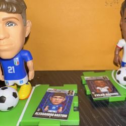 Two ZURU Ballers World Cup player figures with matching player cards.