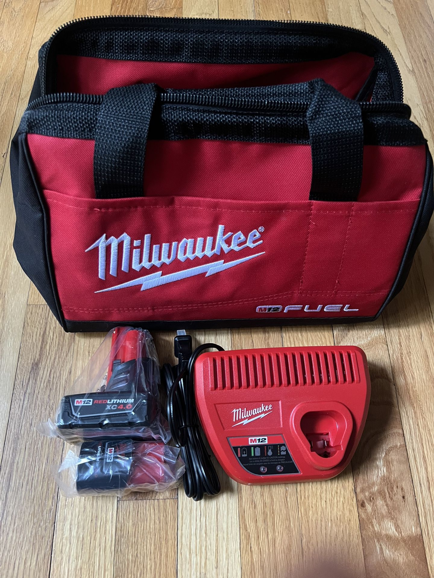 Milwaukee M12 XC 4.0 And 2.0Ah battery kit with Charger and M12 Fuel bag