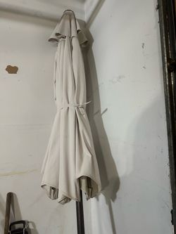 9 FOOT BEIGE PATIO UMBRELLA