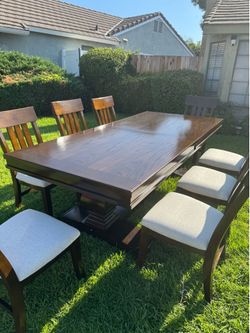 Dark Wood Pedestal Dining Table With 8 Chairs.