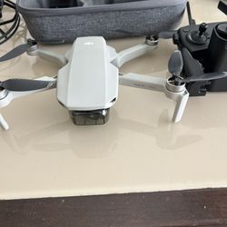 DJI MAVIC MINI WITH THE INFAMOUS FLY MORE COMBO WITH BOX,3 BATTERIES, DRONE, REMOTE, BOX AND ACCESSORIES