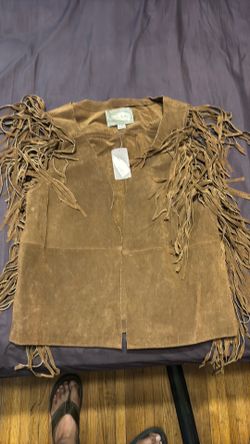 Medium Tan suede fringe vest.