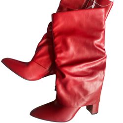 Red knee-high leather boots with pointed toe and zipper closure