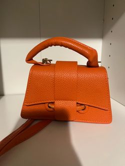 Small orange handbags