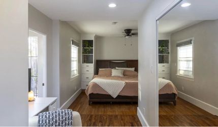 king bed frame with dark wood headboard and 4 side wood frame