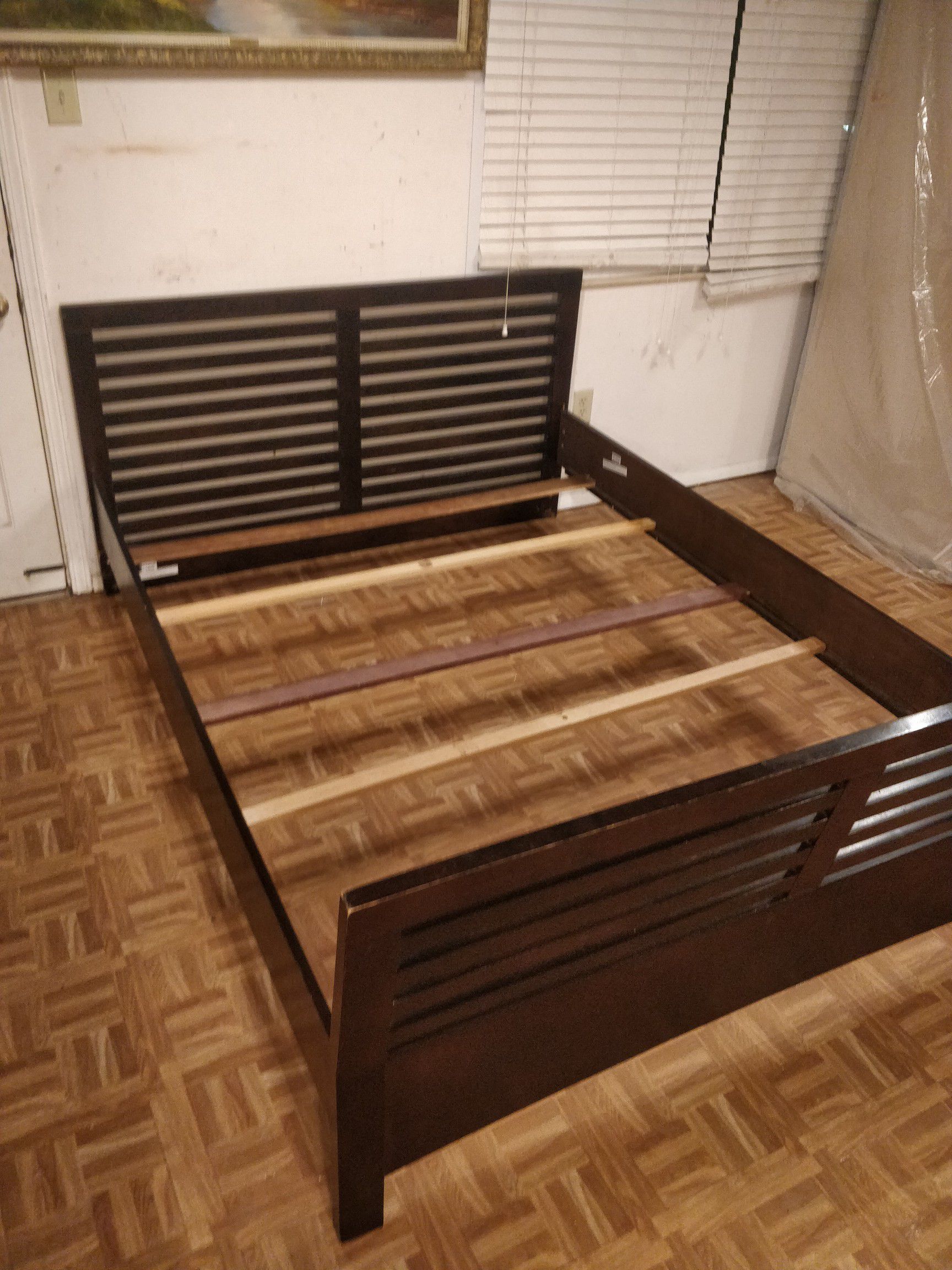 Modern Queen bed frame in good condition, pet free smoke free, driveway pickup.