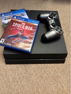 Playstation 4 (including HDMI cable, 2 games, and controller with charger)
