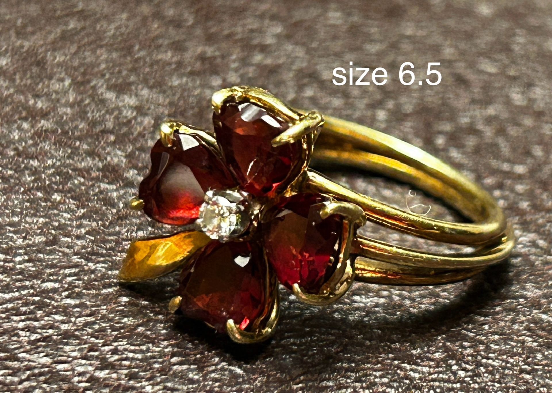 Semi Antique garnet ring size 6.5 with center diamond chip