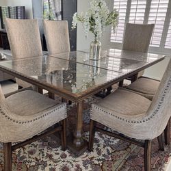 Matching carved dining table, buffet, and armoire with mirrors