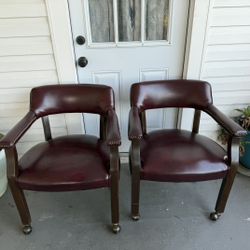 Pair Of Leather Upholstered Arm Chairs