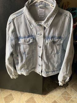 Woman’s distressed denim trucker jacket from RVCA size (L)-(12)