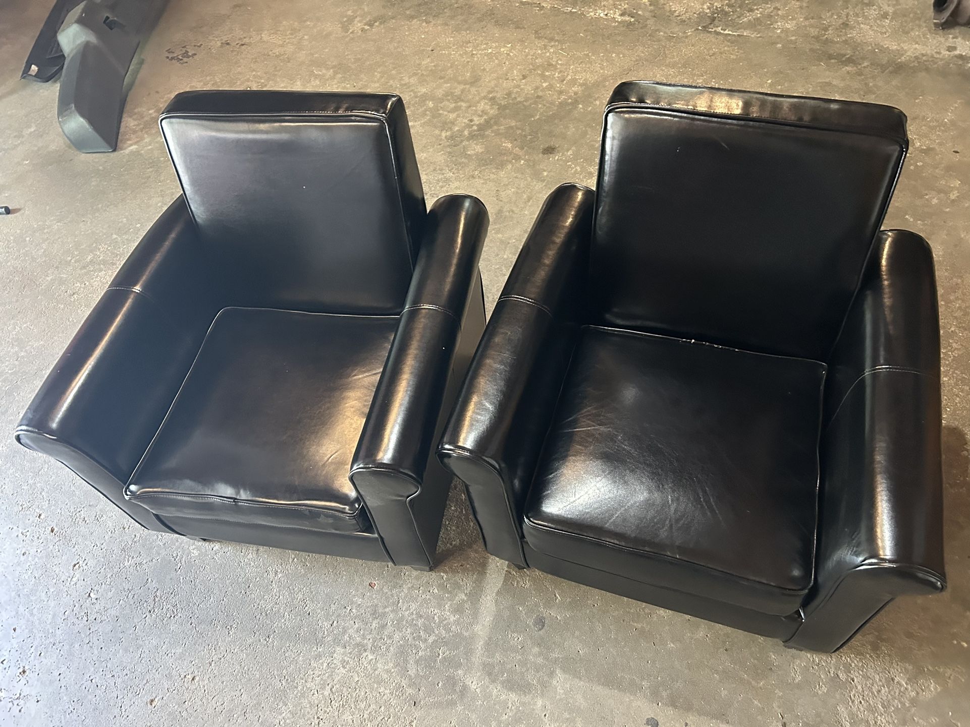 Set Of Black Chairs 32” Tall 30” X 28” Wide In good condition, no tears or rips.