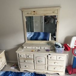 Queen bed; Dresser with mirror; One night stand