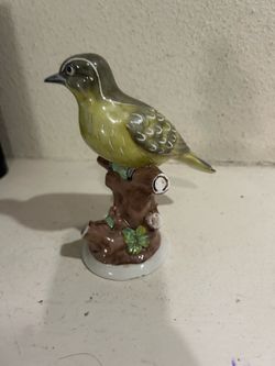Small chip on bottom burd figurine